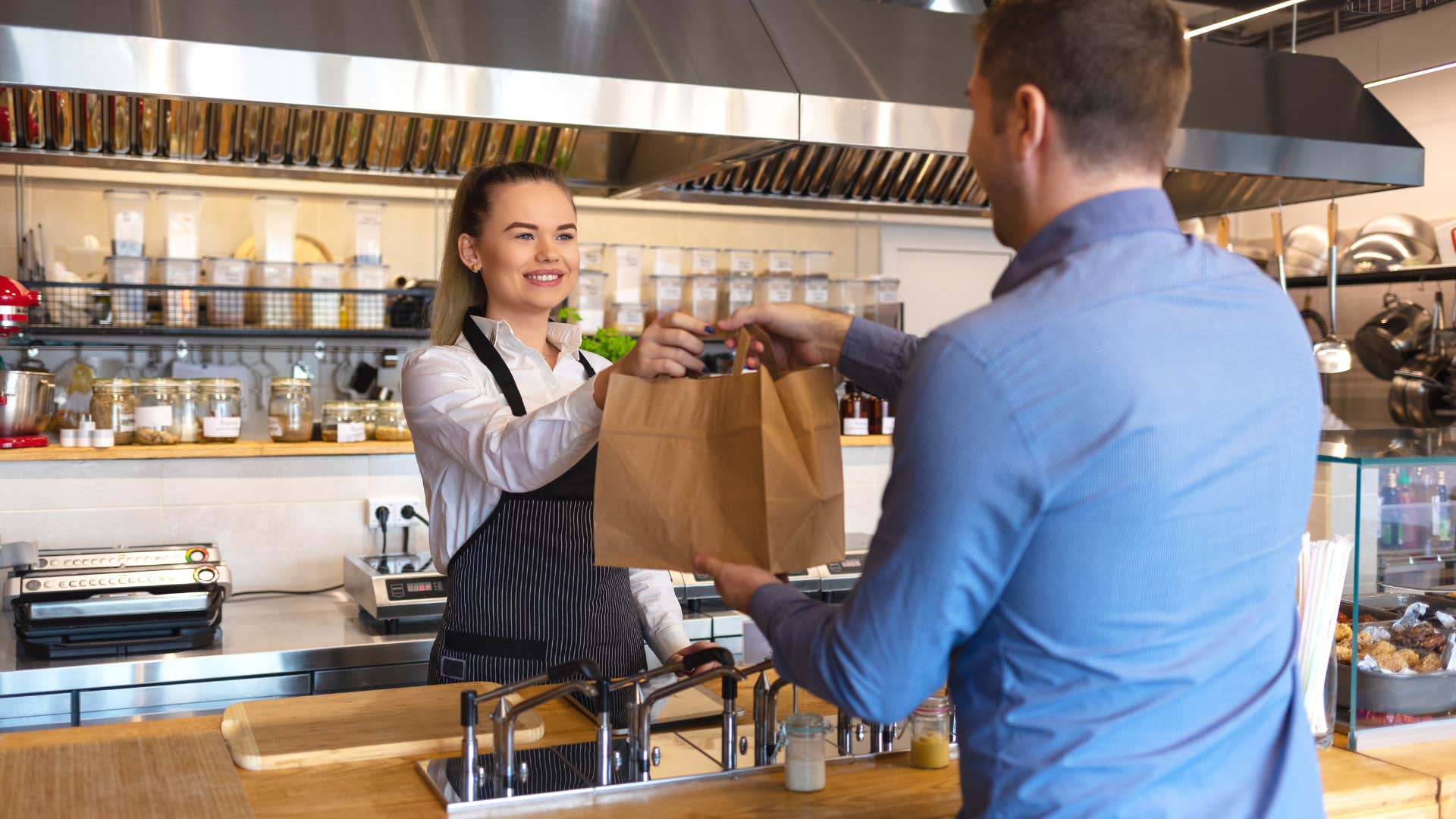 man buying lunch from cafe
