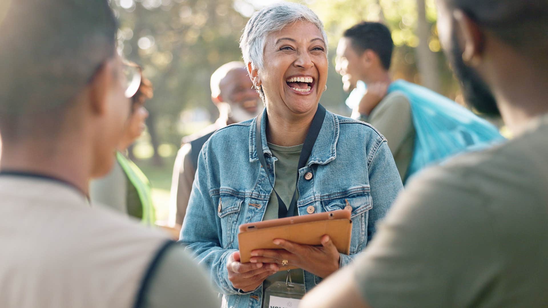 woman smiling and saying please politely to her friends