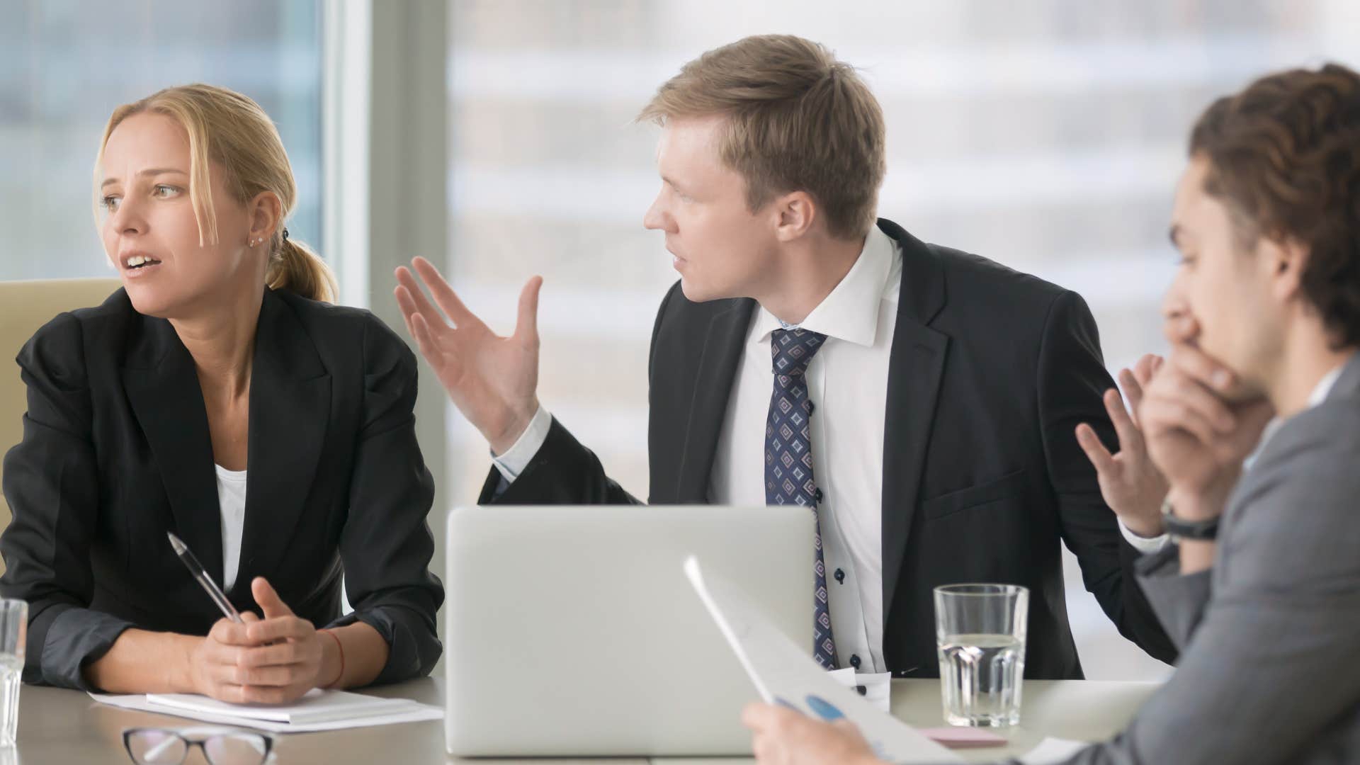 a woman says whatever to her boss and coworkers during a meeting