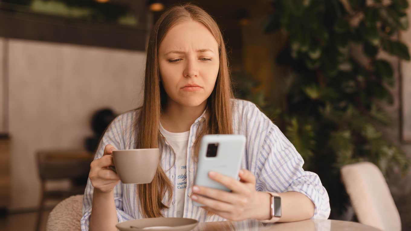 Airbnb Host Demands Guest Pay For Damaged Mattress Using Image Taken From The Internet confused woman looking at phone