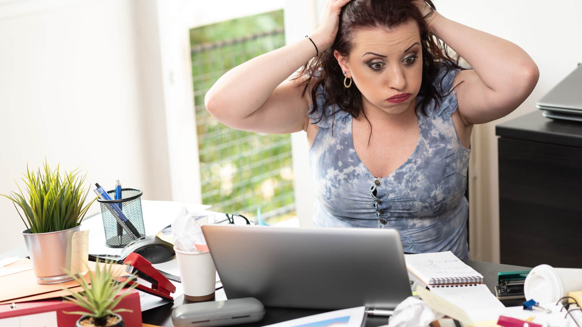 woman working in a messy office