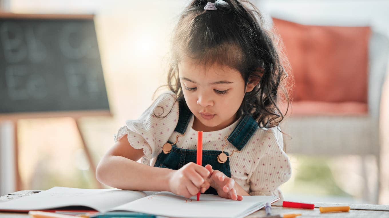 Basic Life Skills Slowly Disappearing From Kids’ Lives little girl struggling to hold a pencil