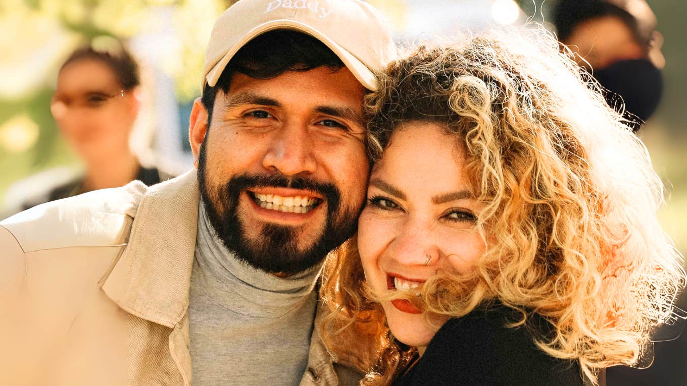 Behaviors That Instantly Show You're a Strong Couple Without Either of You Saying a Word Strong couple embracing.