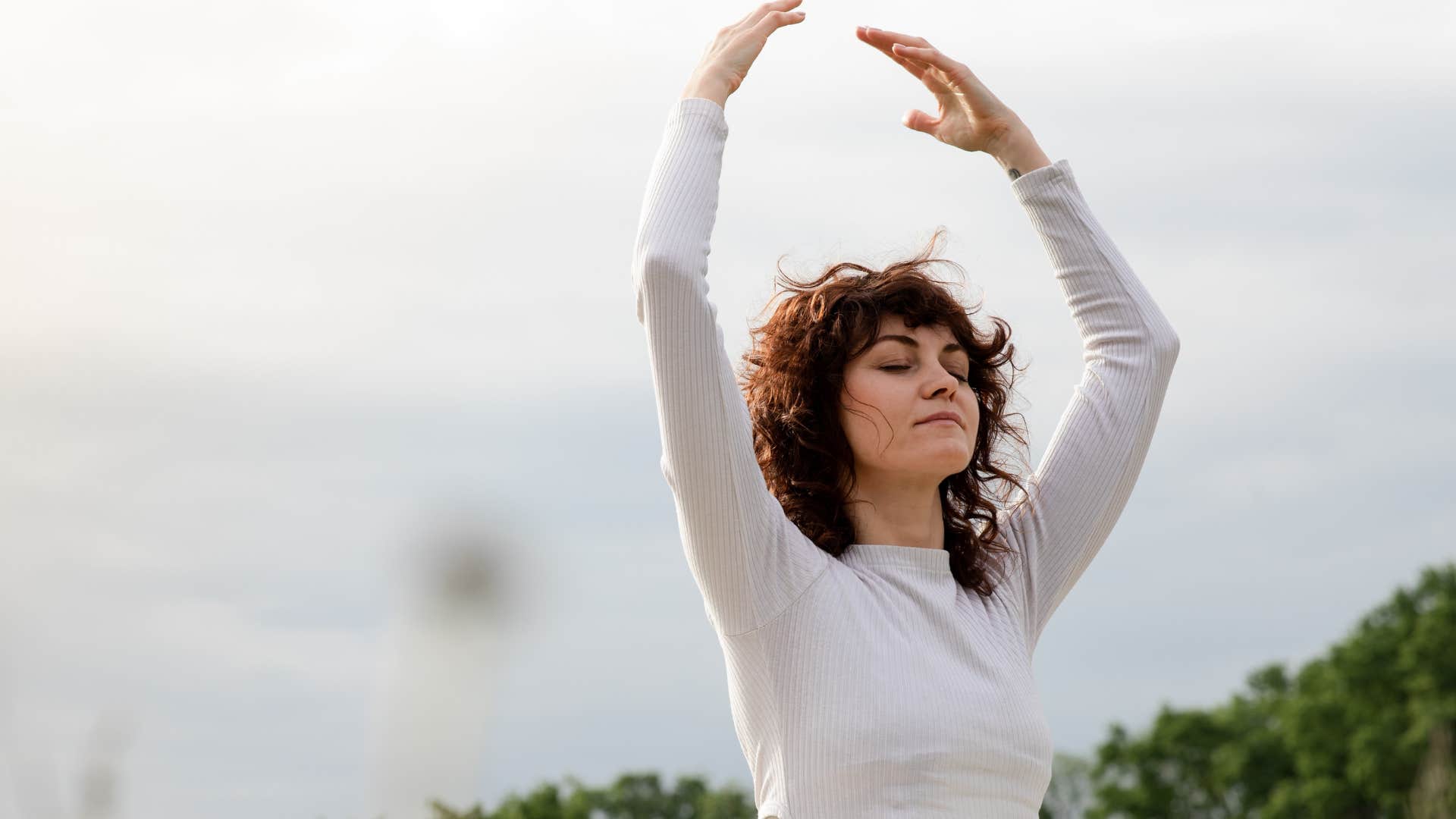 peaceful woman giving back to nature