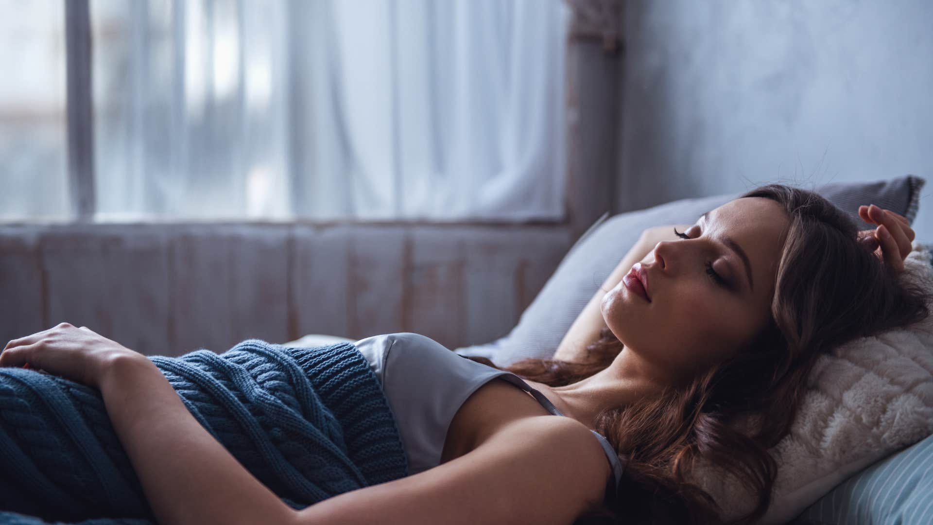 woman who falls asleep and stays out cold by creating better sleep environment