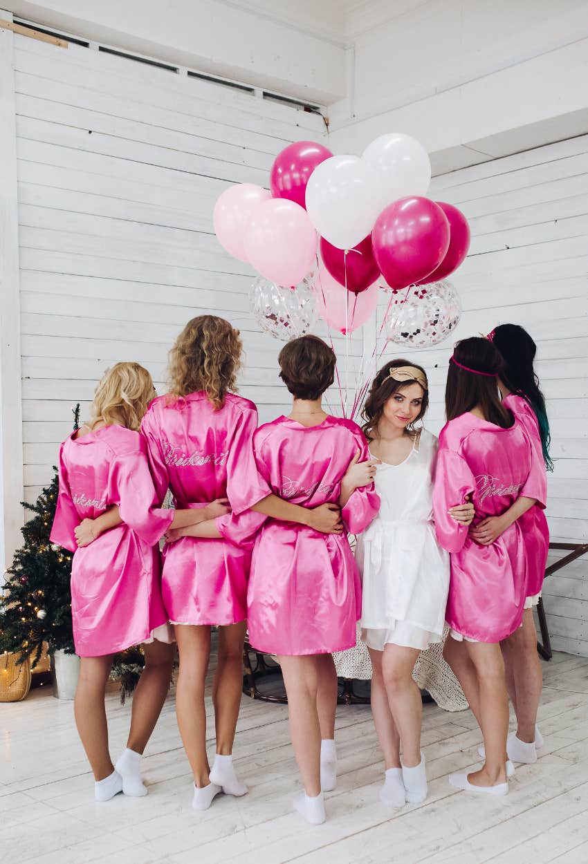 Bride with bridesmaids who she hopes all look slim on her wedding day