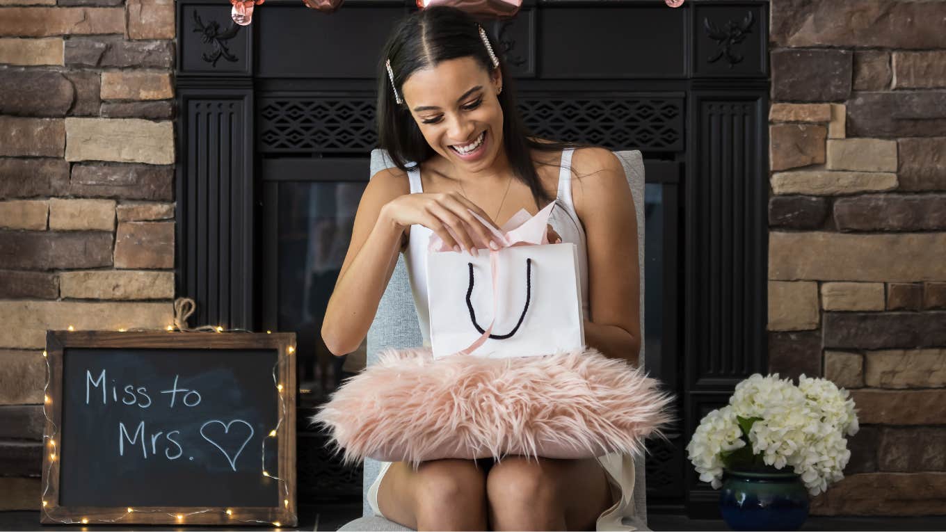 Bridesmaid Receives Invoice From Bride's Mom For Bridal Shower Bride opening gifts at shower that bridesmaid got a surprise invoice for