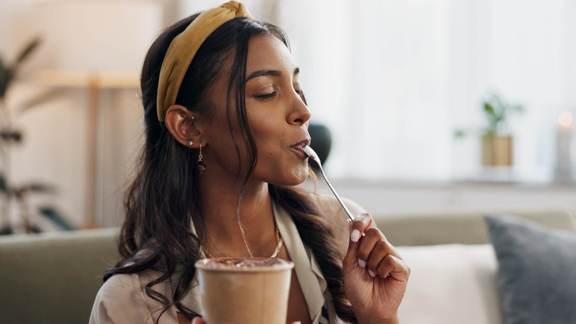 woman eating and drinking before leaving home