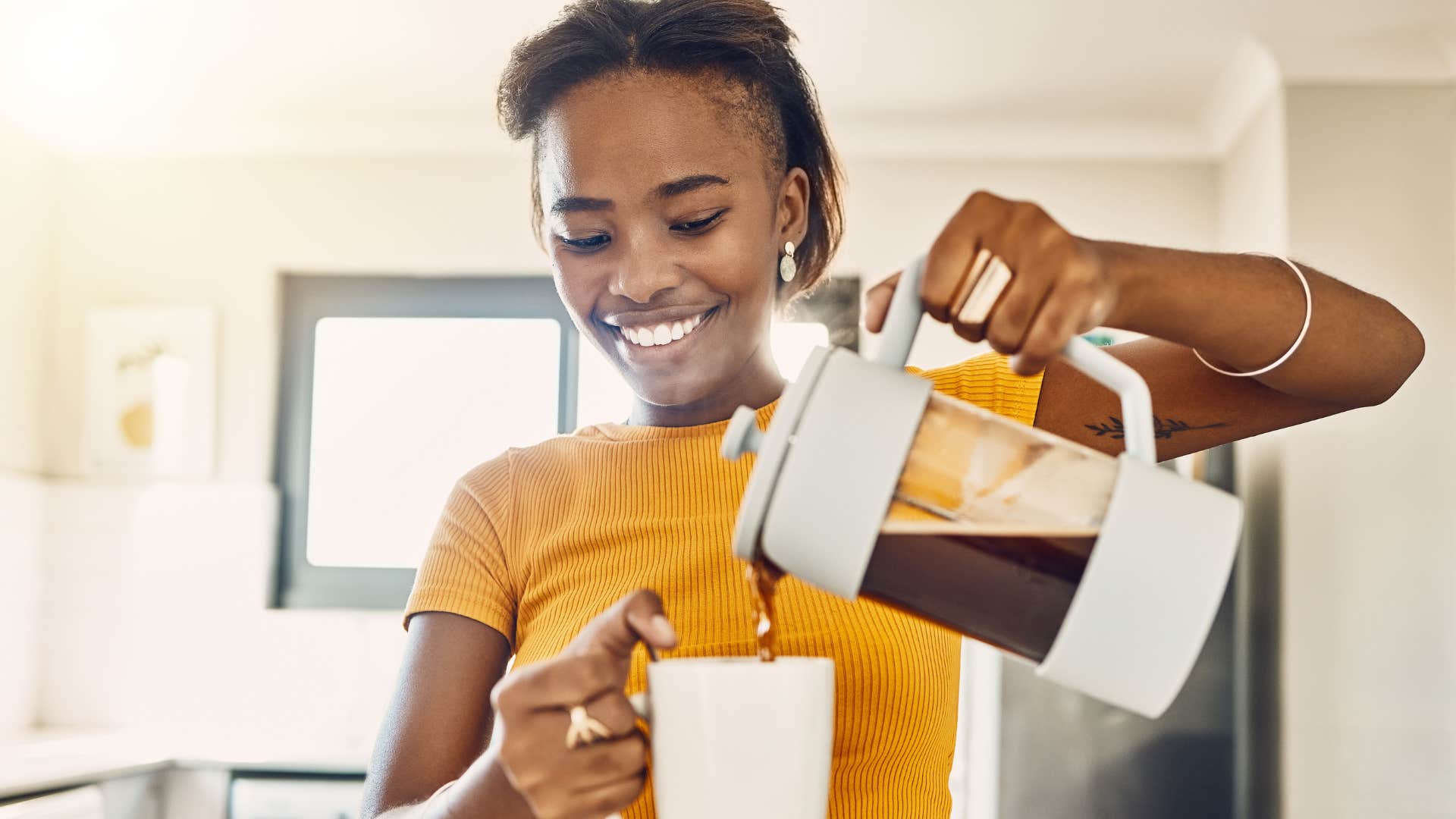 woman making instant coffee at home