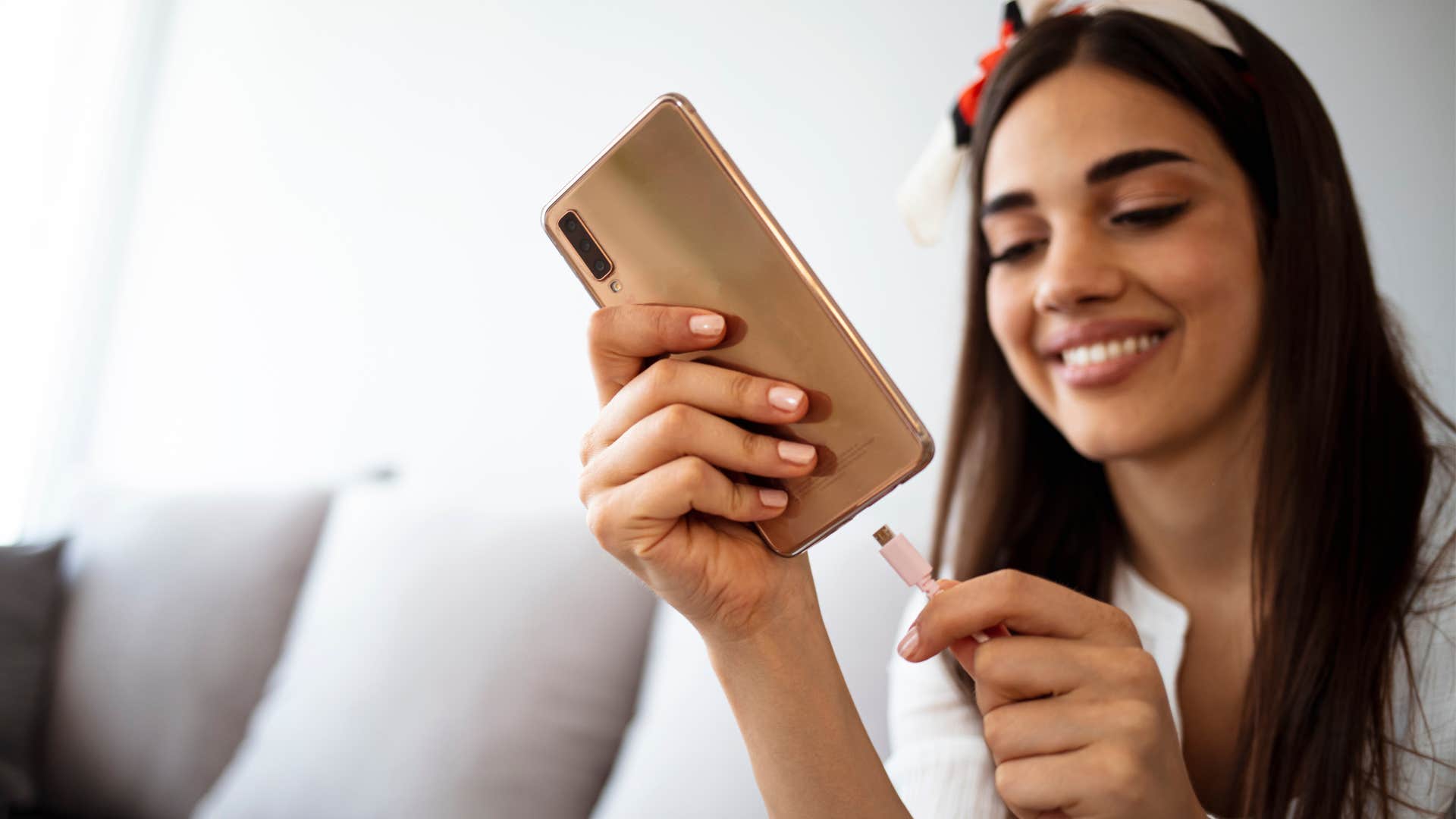 woman using rechargeable electronics at home
