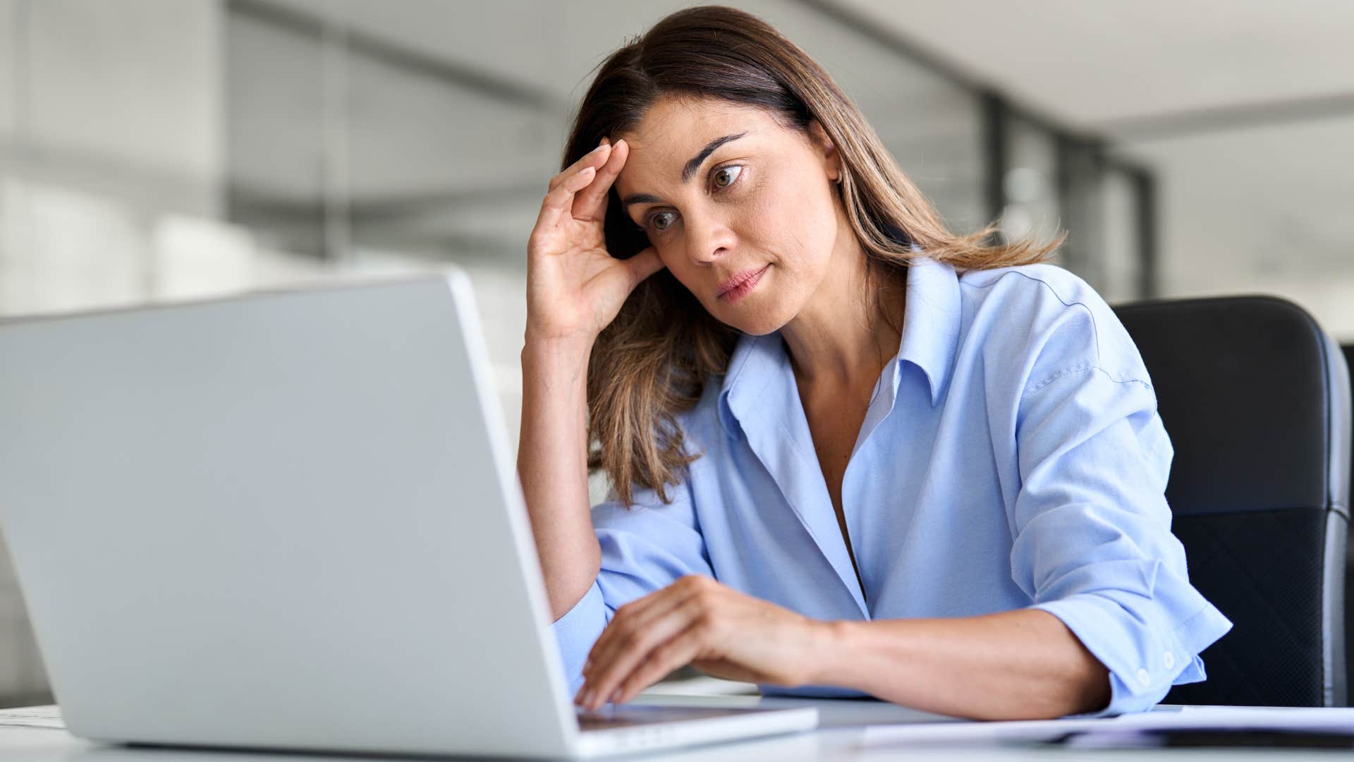 stressed woman saying let's circle back to that on her laptop