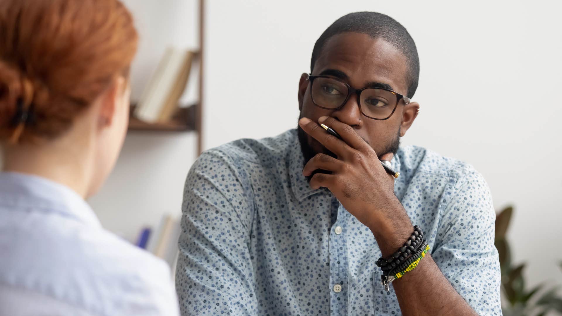 man saying let's put a pin in that to a co-worker
