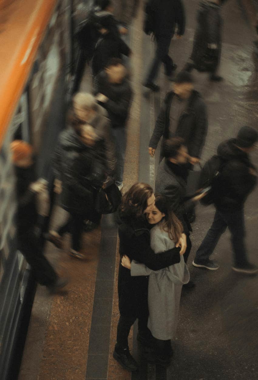 couple hugging before departing
