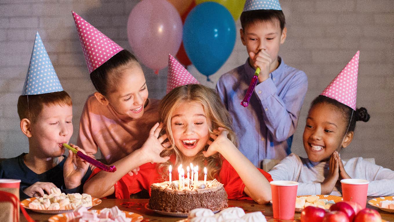 dad asks wrong not punish daughter yelling girl ruined birthday party girl blowing out candles on cake at birthday party