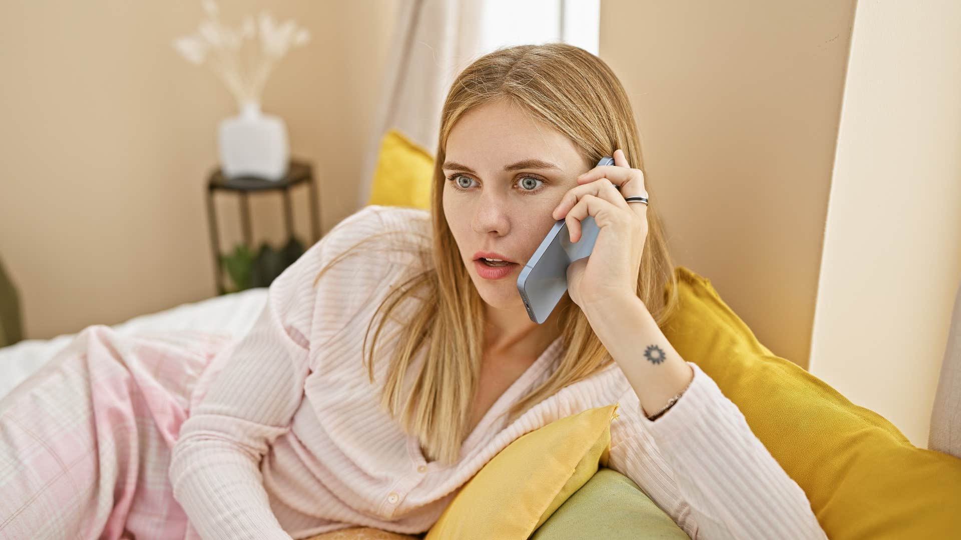 woman on a phone call looking concerned