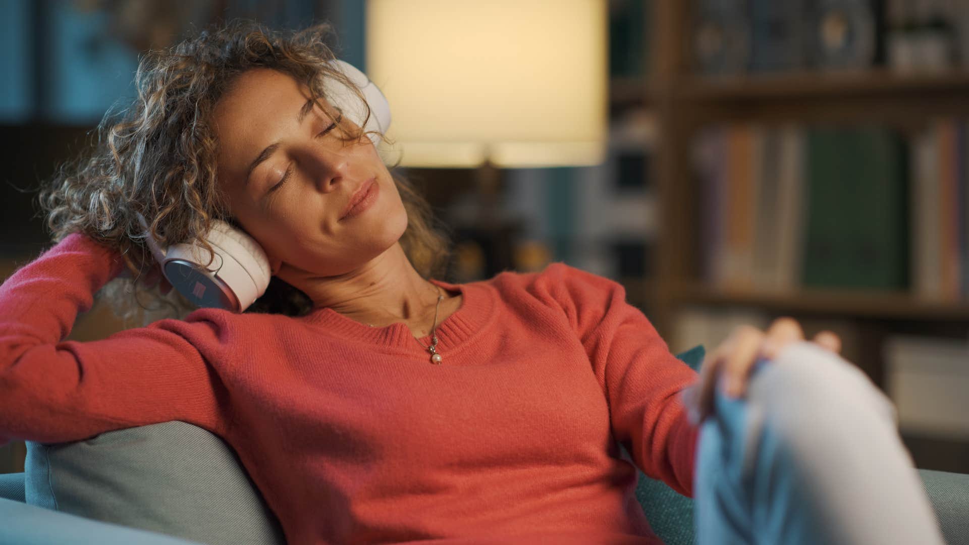 polished woman prioritizing rest and relaxing listening to music