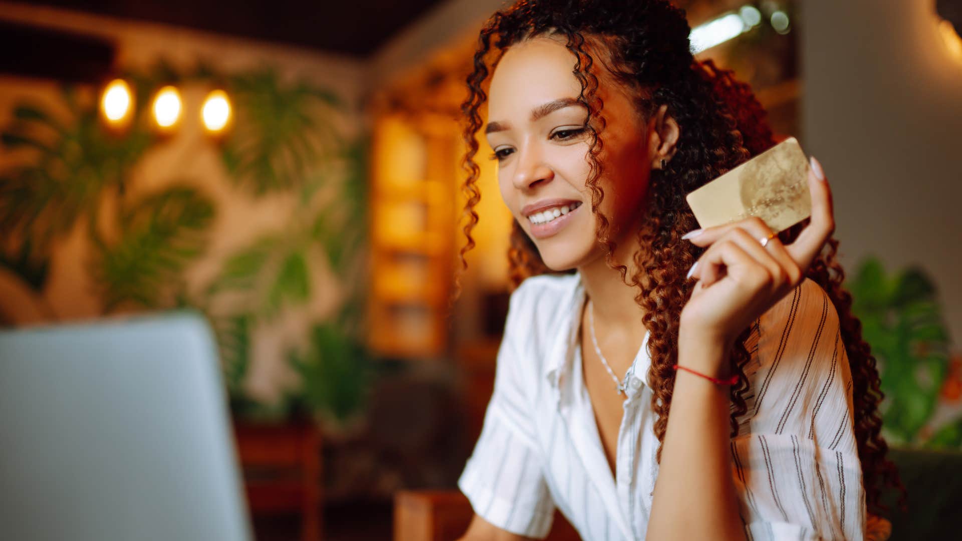 Woman who can ignore their bank accounts spending money online.