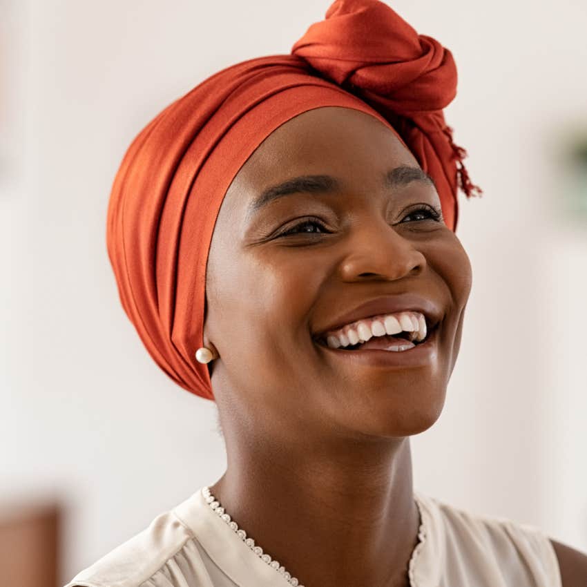 woman who thrives in her job laughing