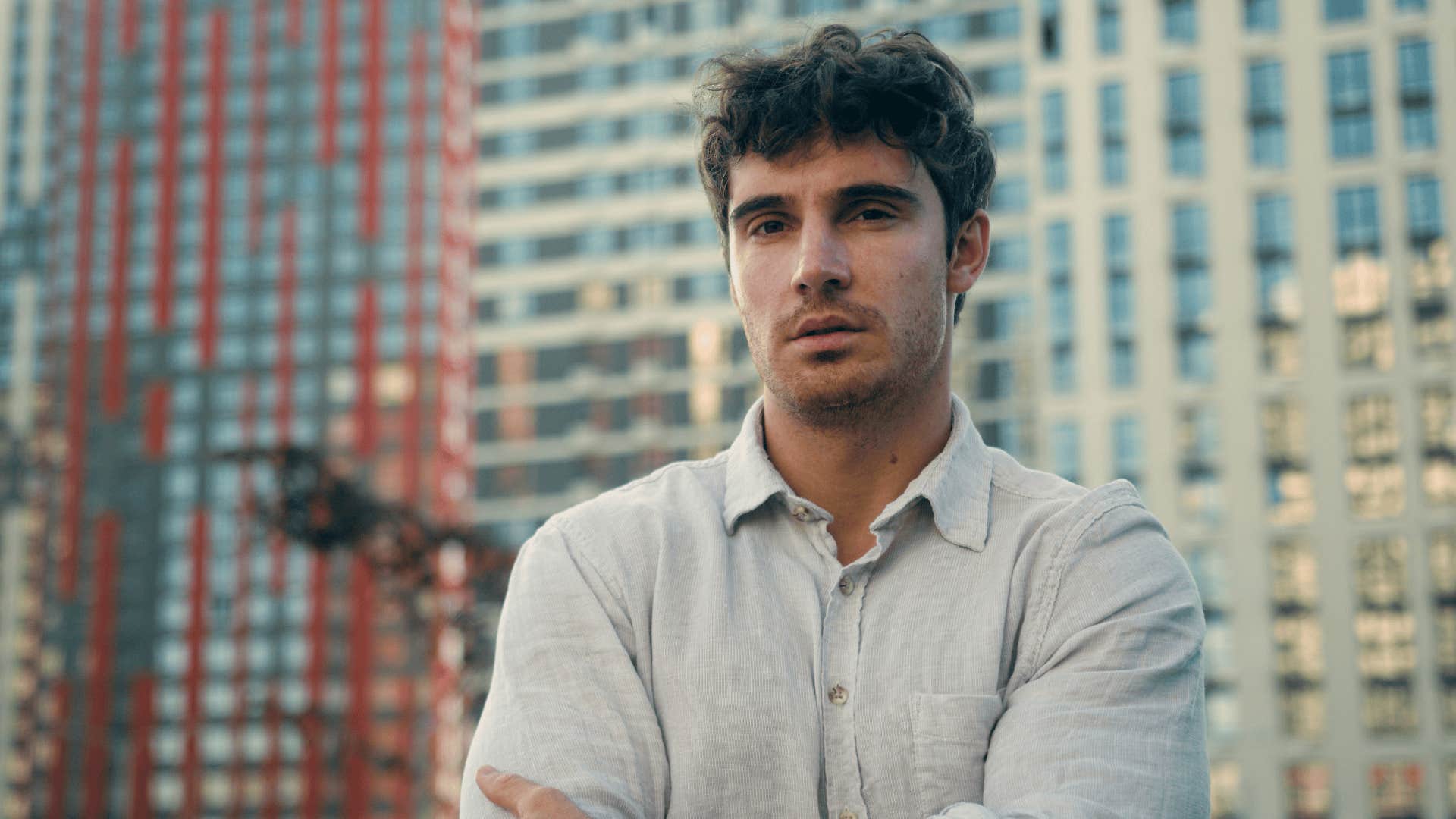 man acts cold and distant around the woman who broke his heart