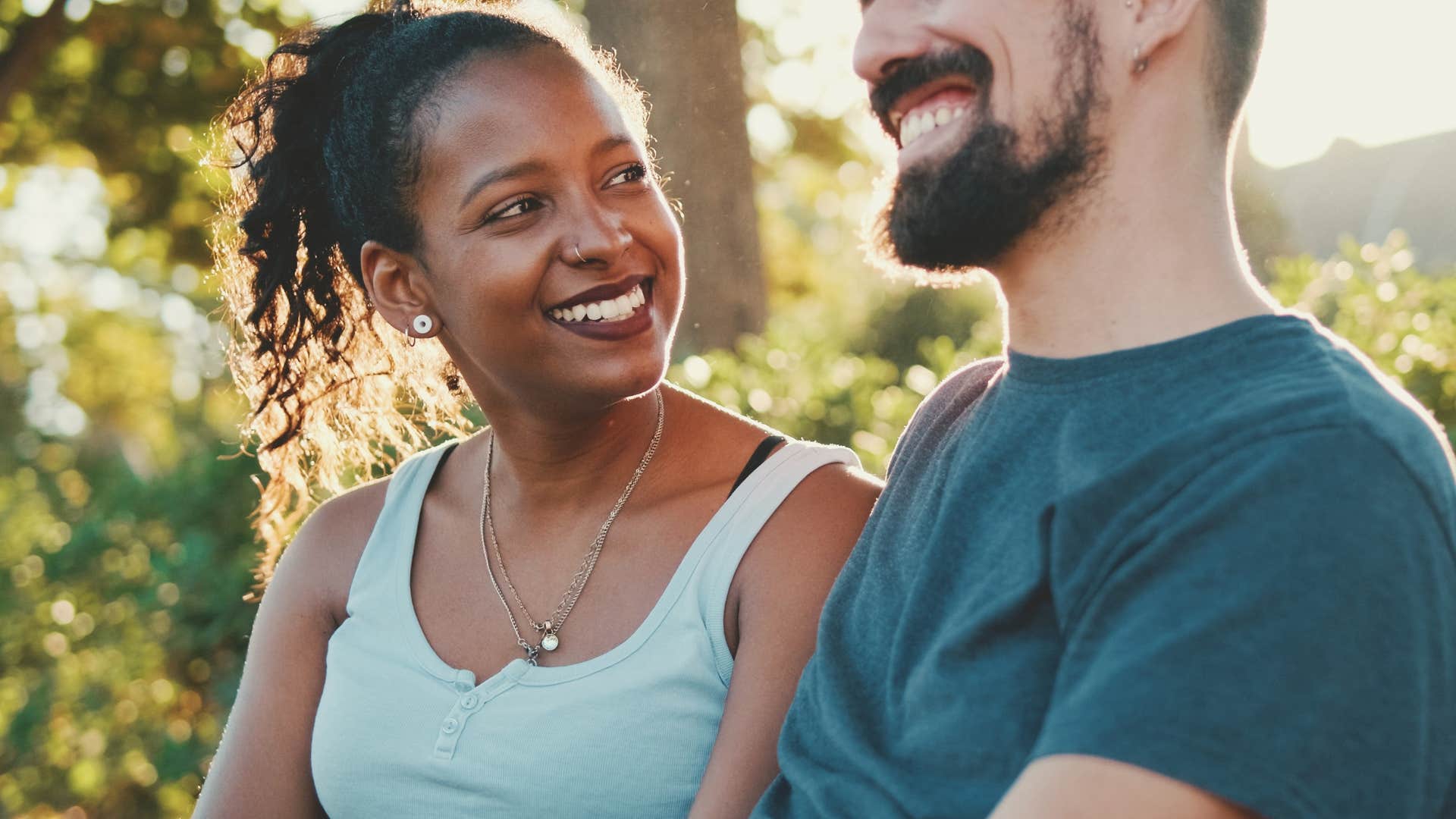 adaptable woman smiling at her partner outside
