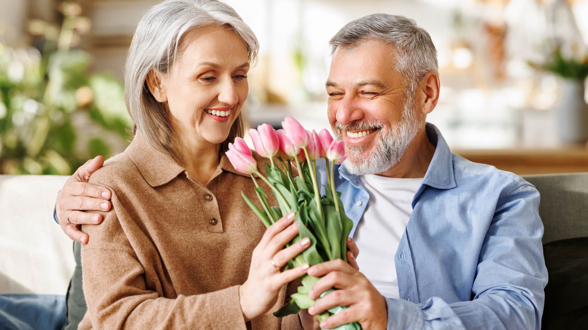 woman who's healthily empathetic holding flowers from her partner