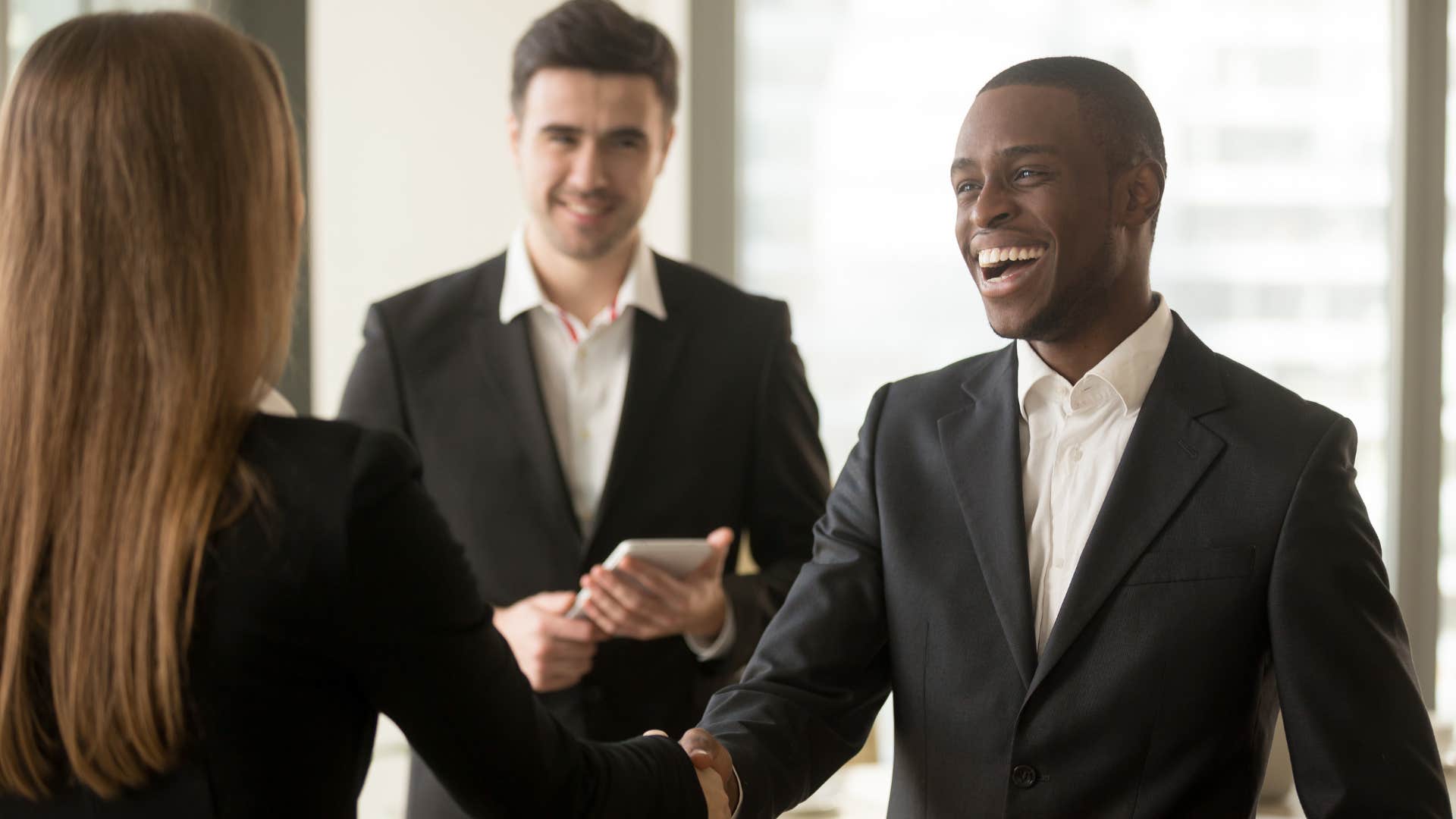 narcissistic professional man shaking hands making good first impression