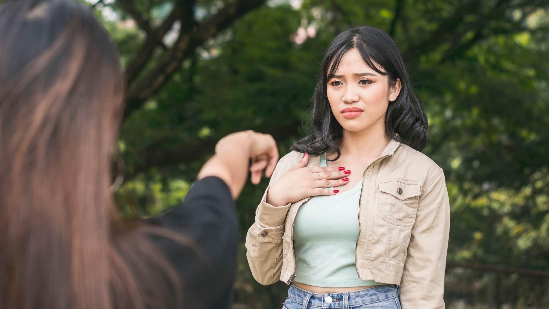 narcissist pointing at woman shifting blame onto her