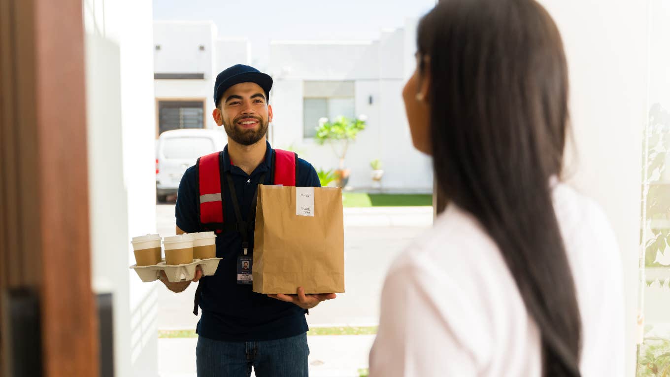 DoorDash Driver Reveals Take-Home Pay After Accepting Every Order For Hours DoorDash driver delivering food to a woman