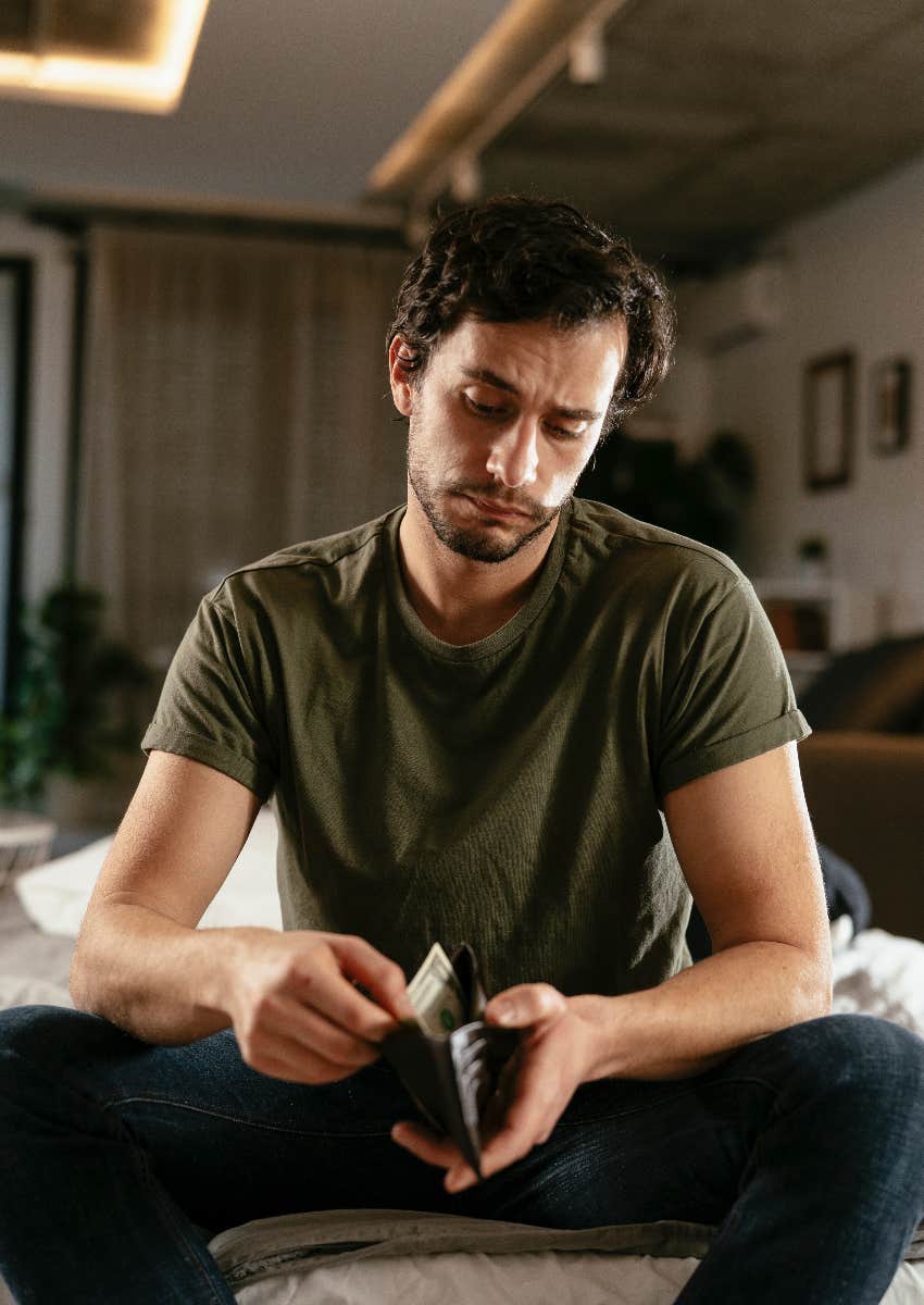 man thinking about getting another full time job to earn more money