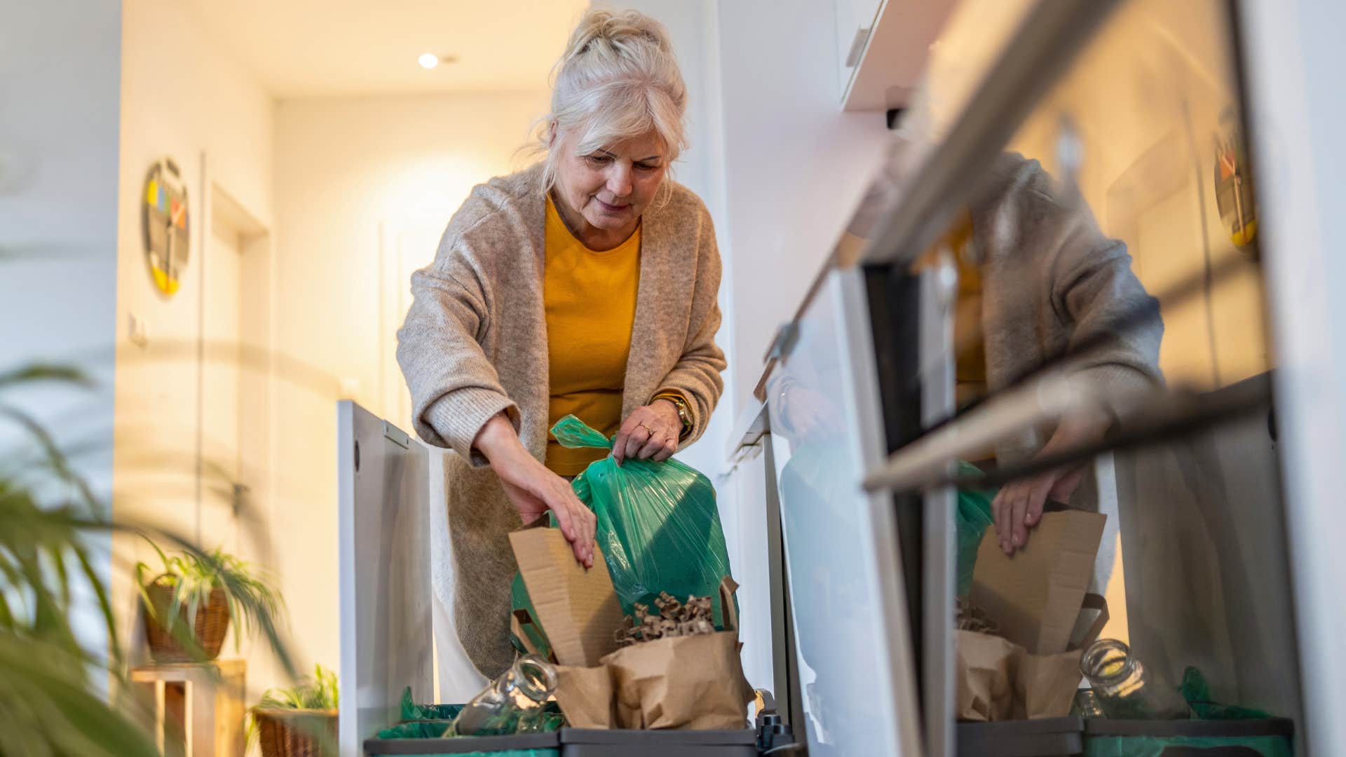 woman removing objects from her home that have negative energy