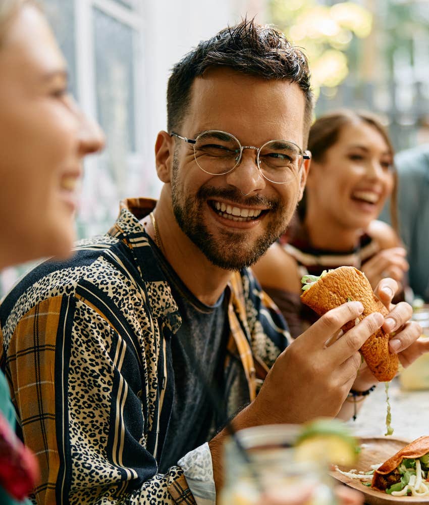 Man happily eating.