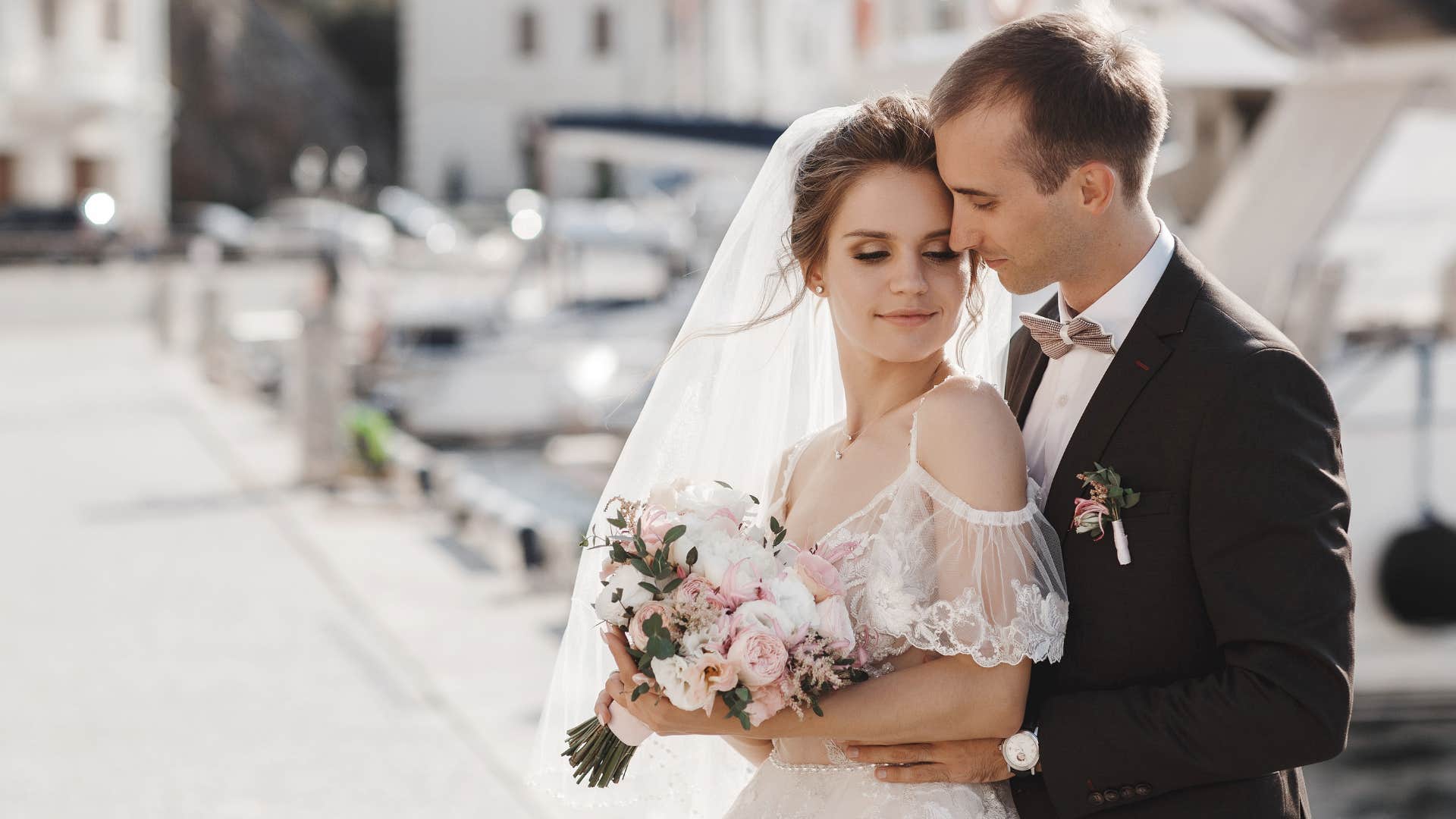 couple taking out a loan for wedding as they pose for camera
