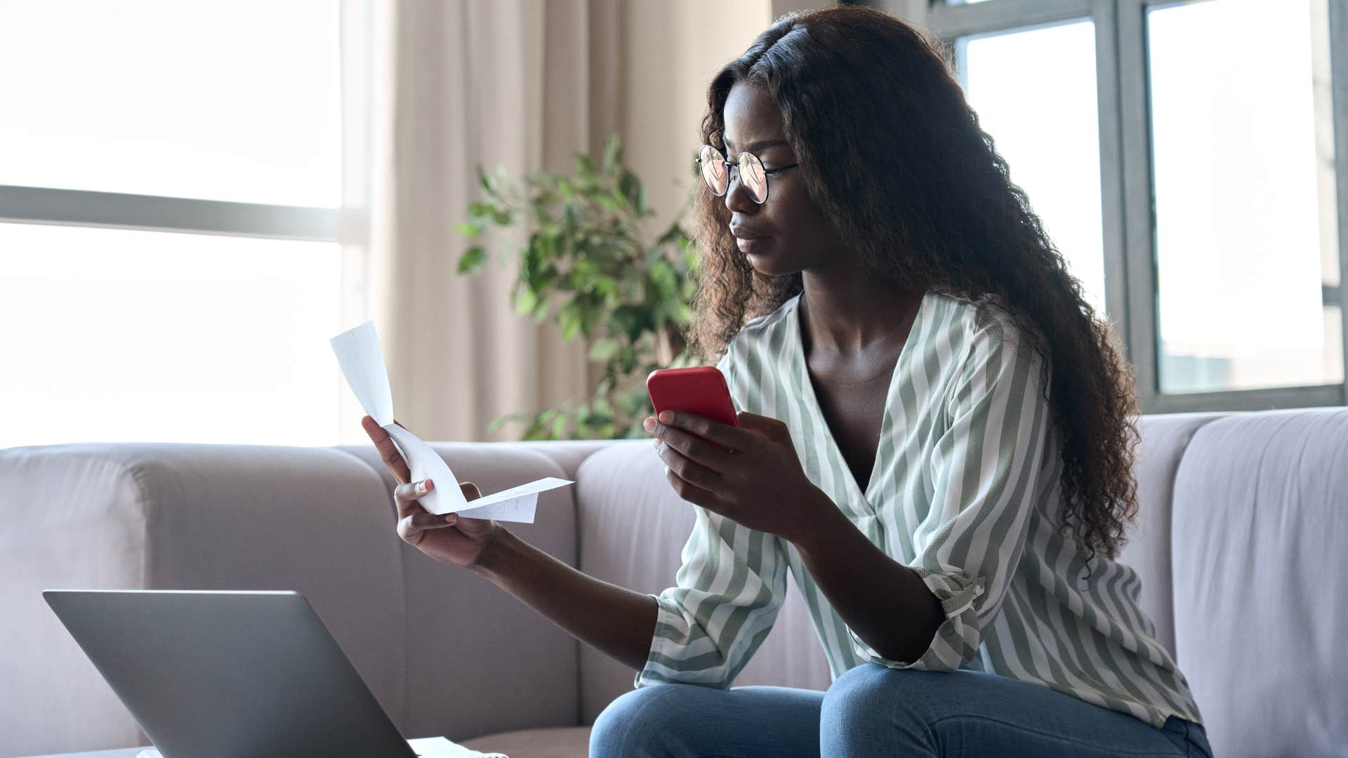woman looking at old receipts