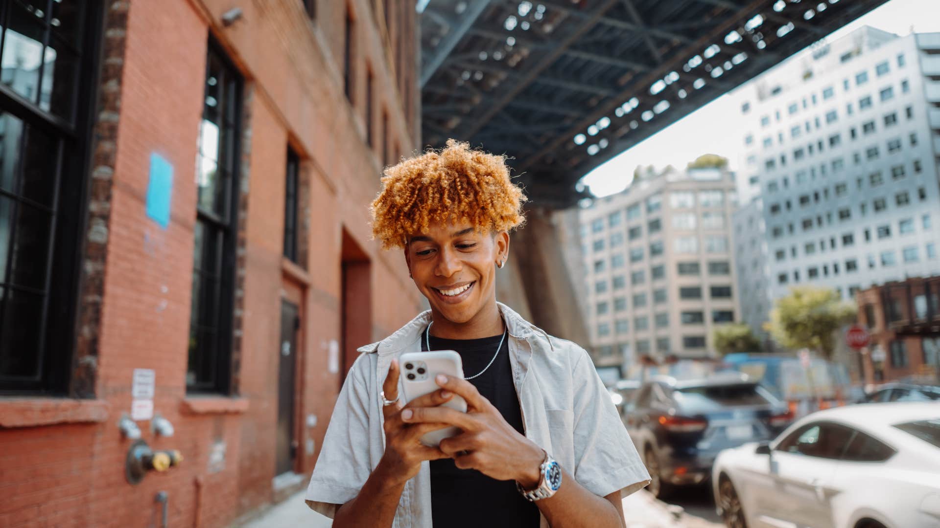 a young man buys a new phone every year it comes out