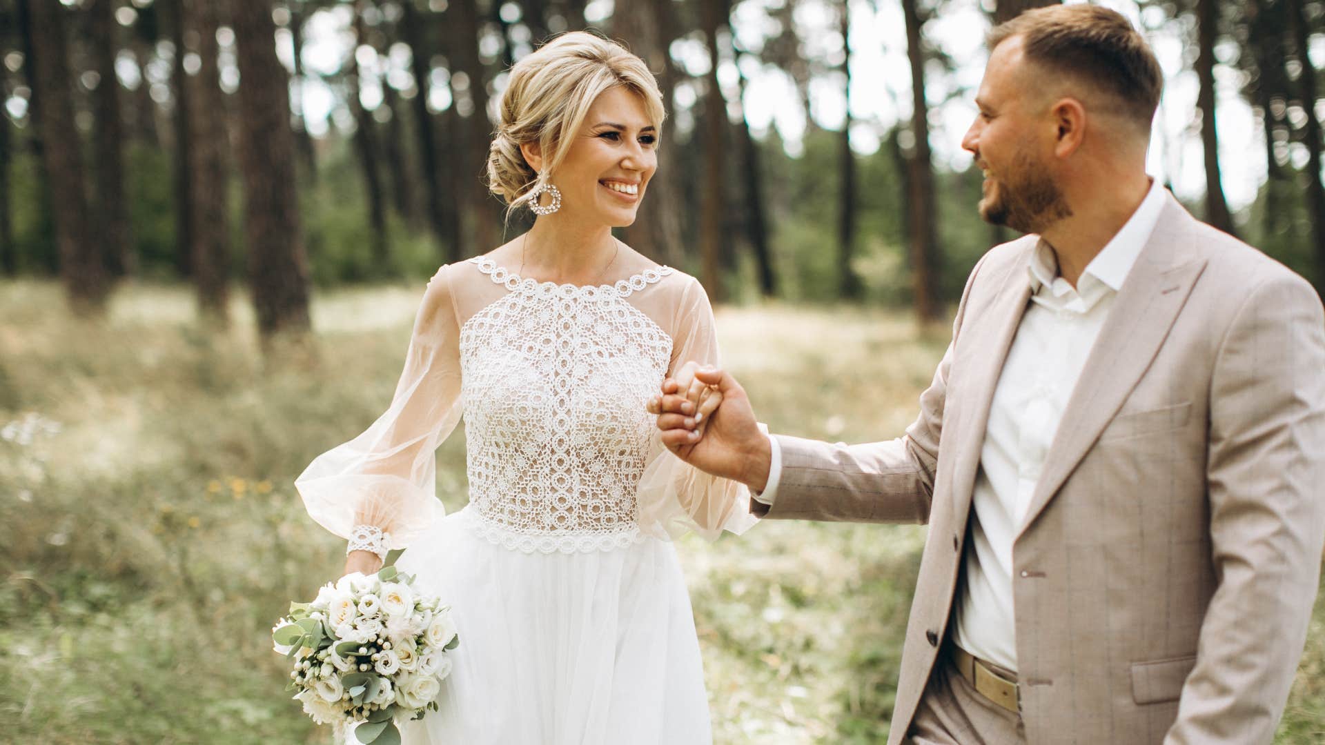 Couple smiling before their huge weddings.