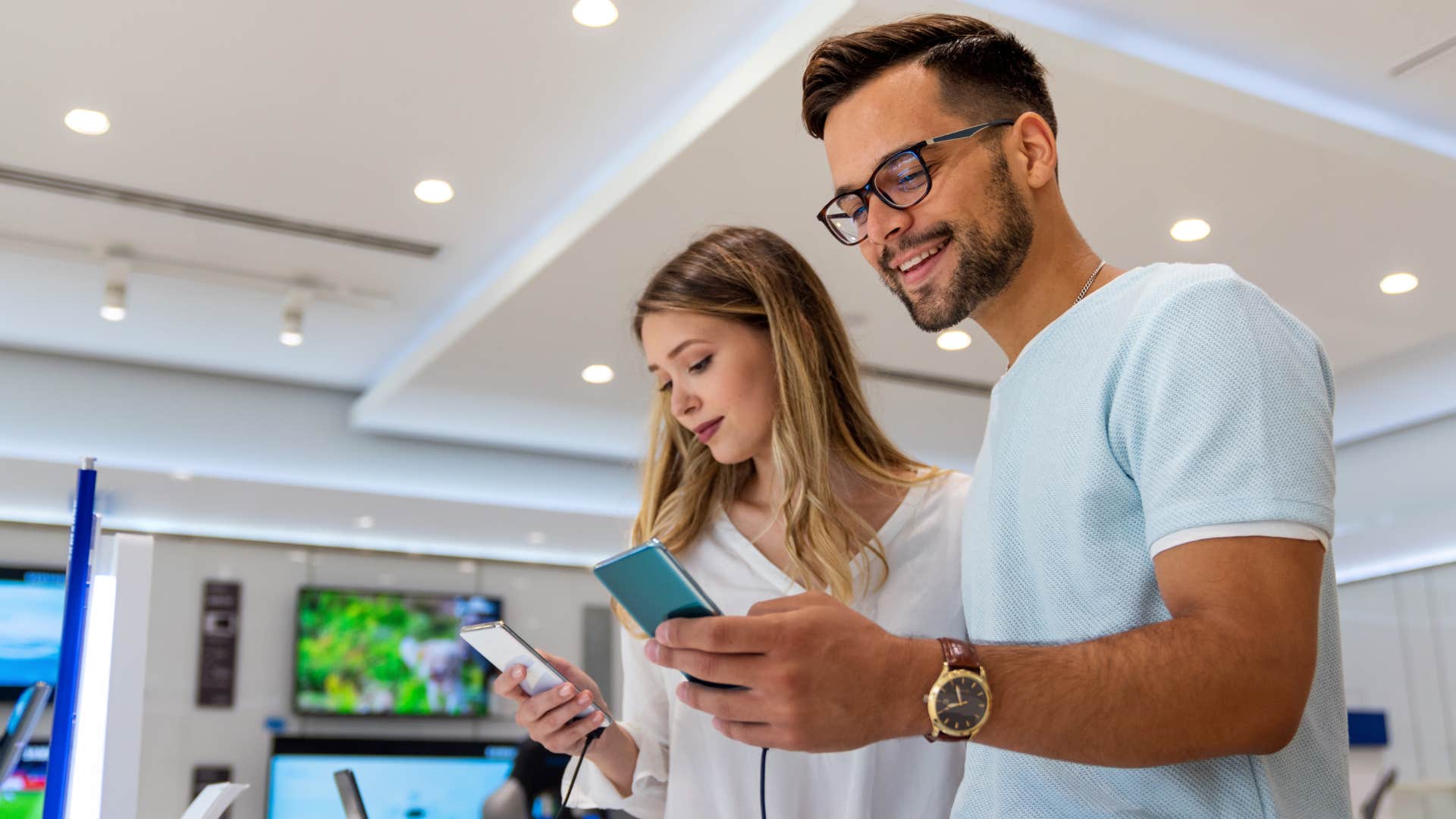Couple shopping for the newest technology device.