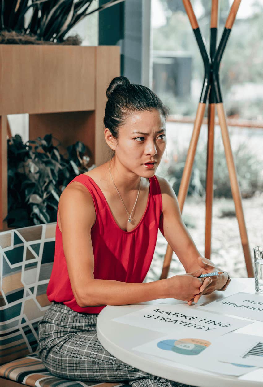 woman listening to explanation of impact