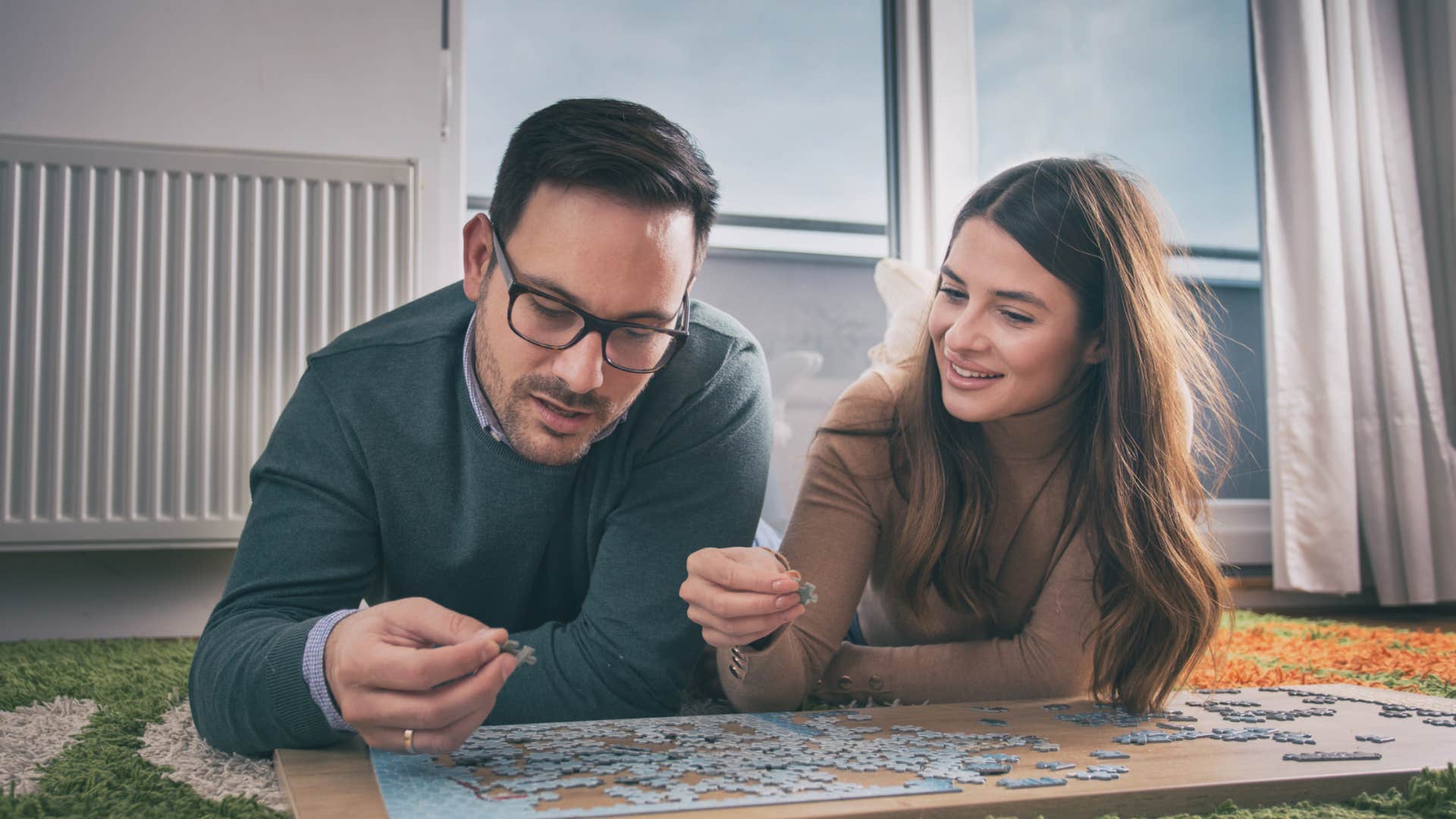 kindred spirit couple with same interests doing puzzle