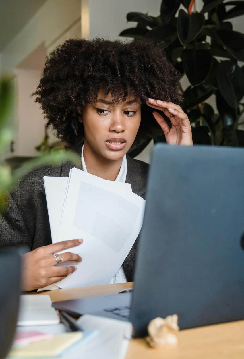 Gen Z woman stressing over bills