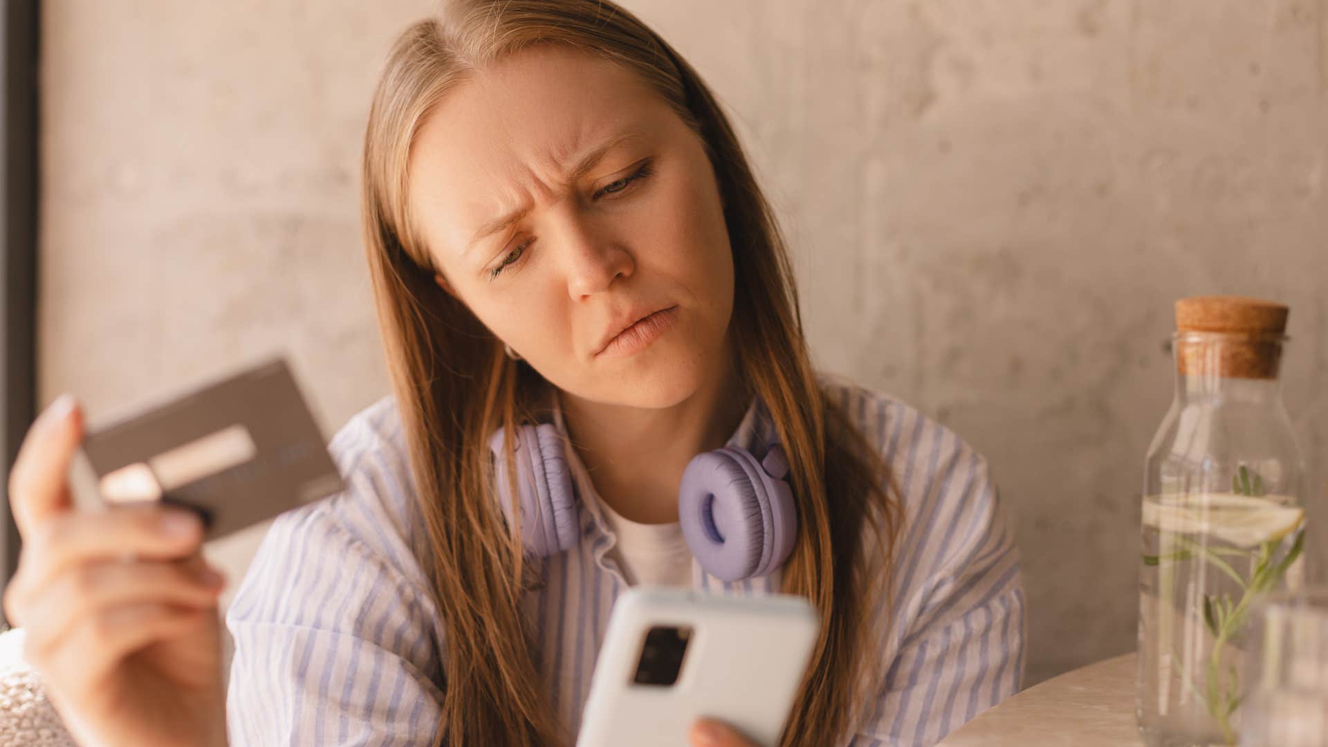woman thinking about what she's going to buy to avoid impulse purchases