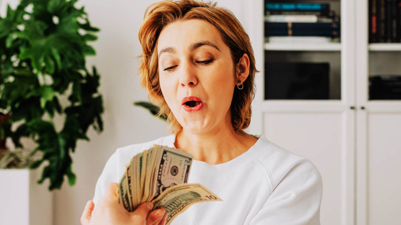 These Habits Make Me More Money Than My Investments Ever Did Person making money.