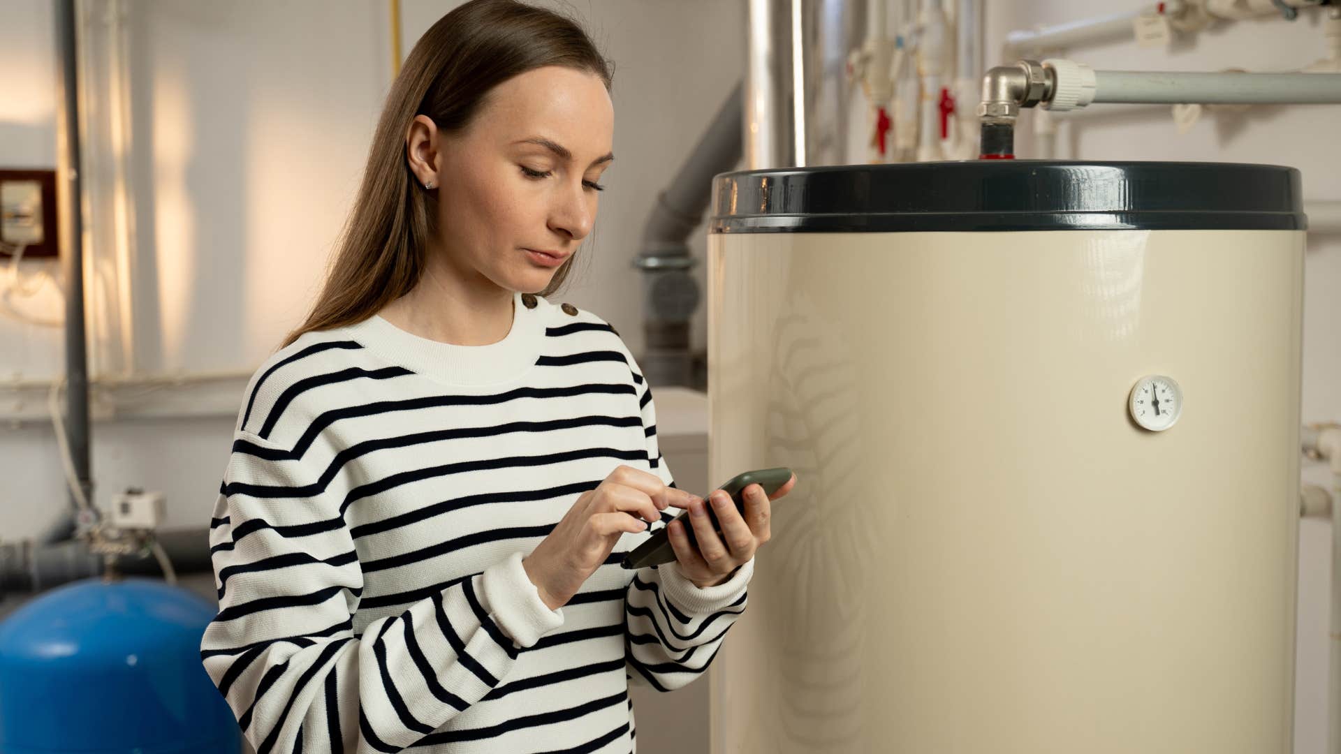 Woman fixing household repairs at home.