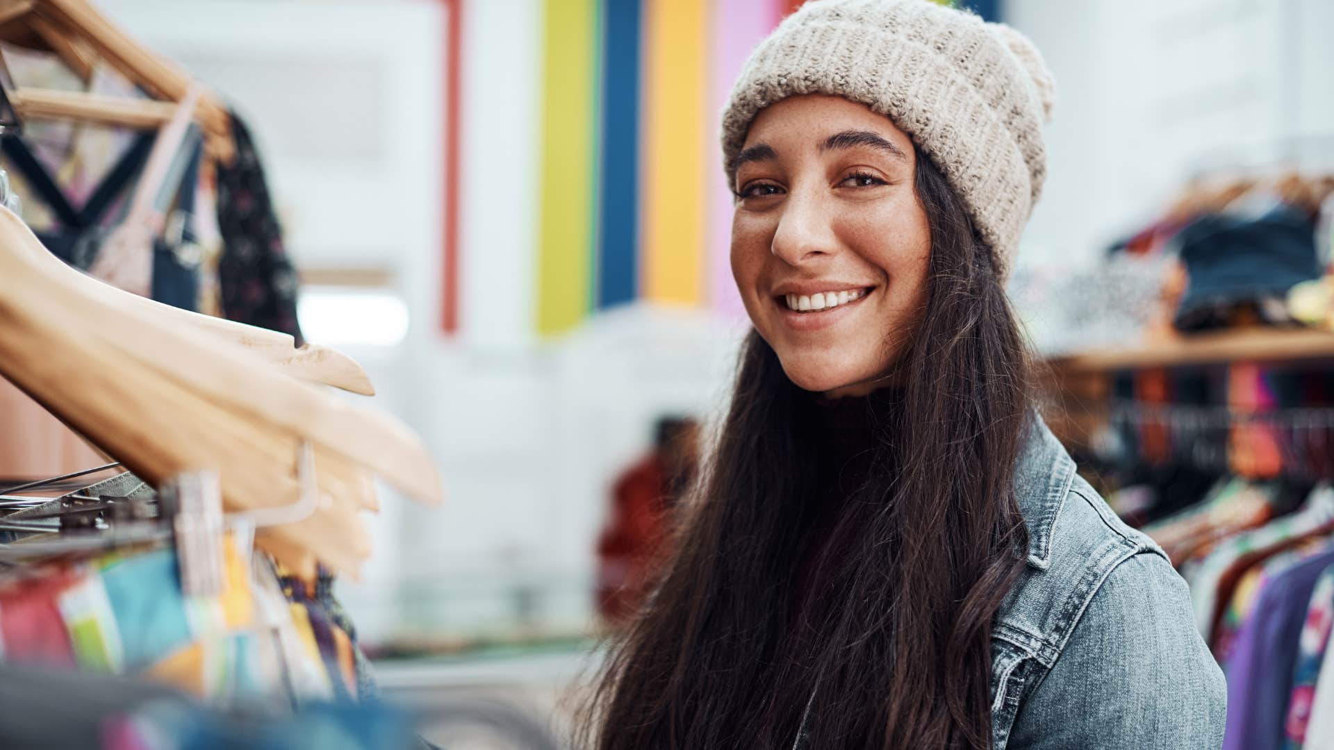 Woman buying flashy status symbols in a store.
