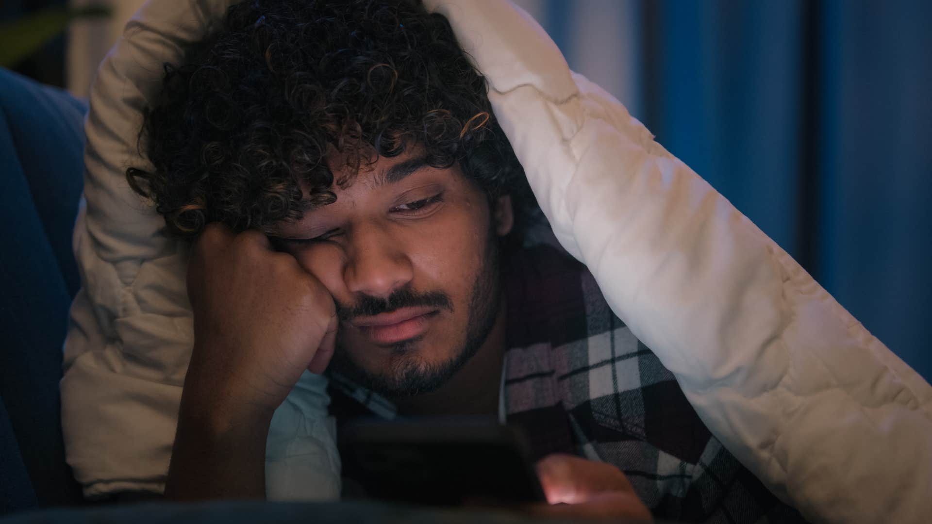 Man watching mindless entertainment on his phone.