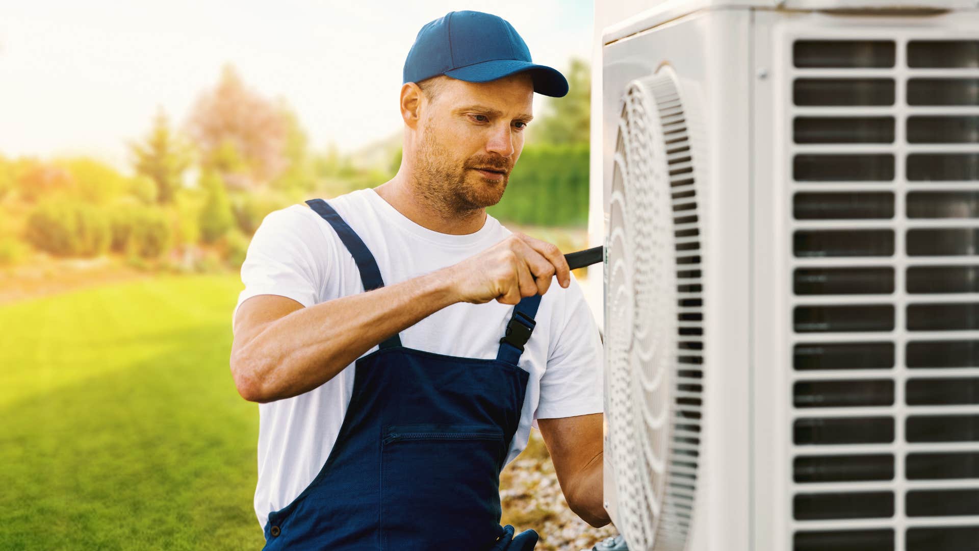 man who repairs things himself fixing an air conditioning unit