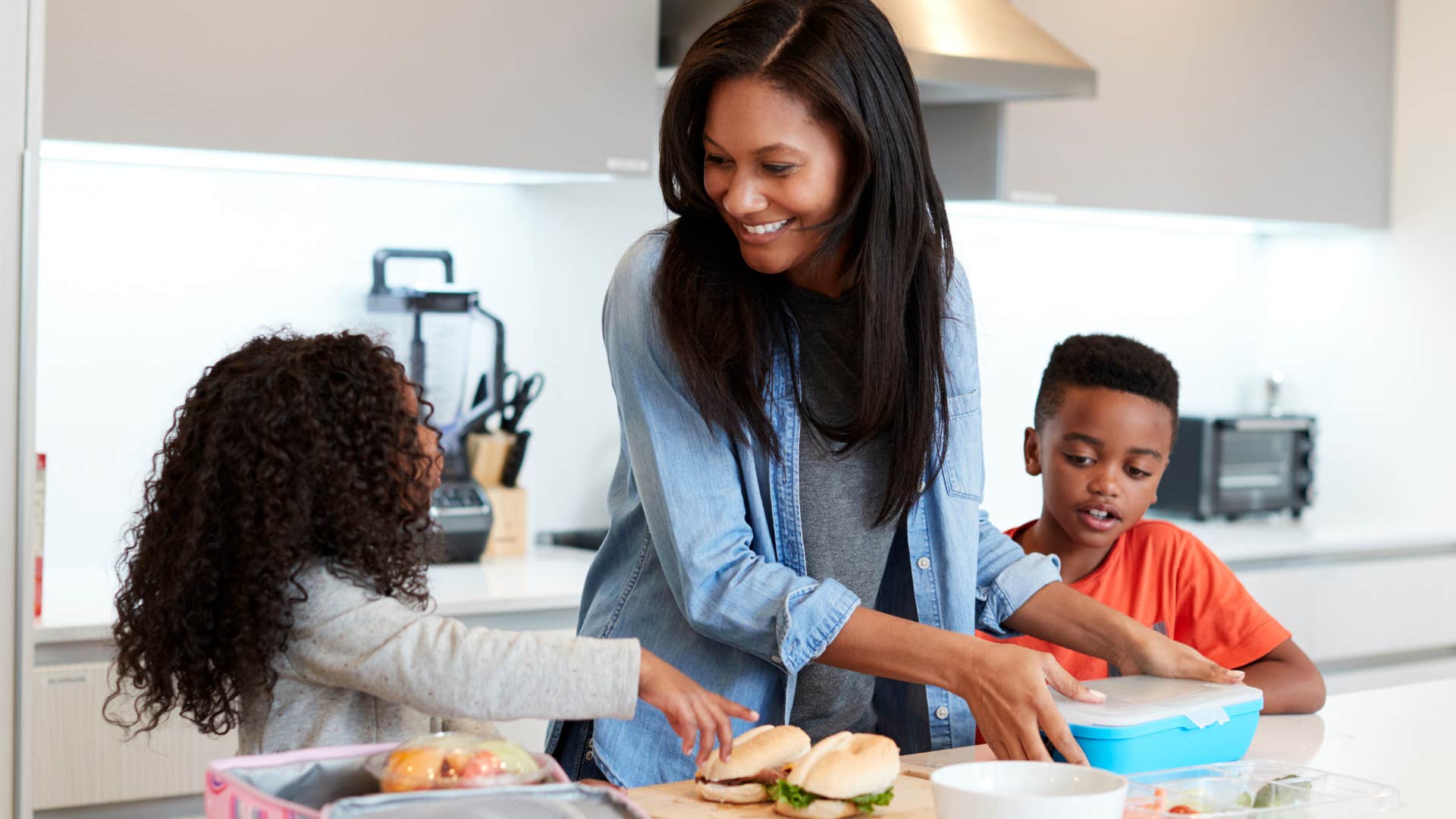 frugal woman packing lunch for her kids