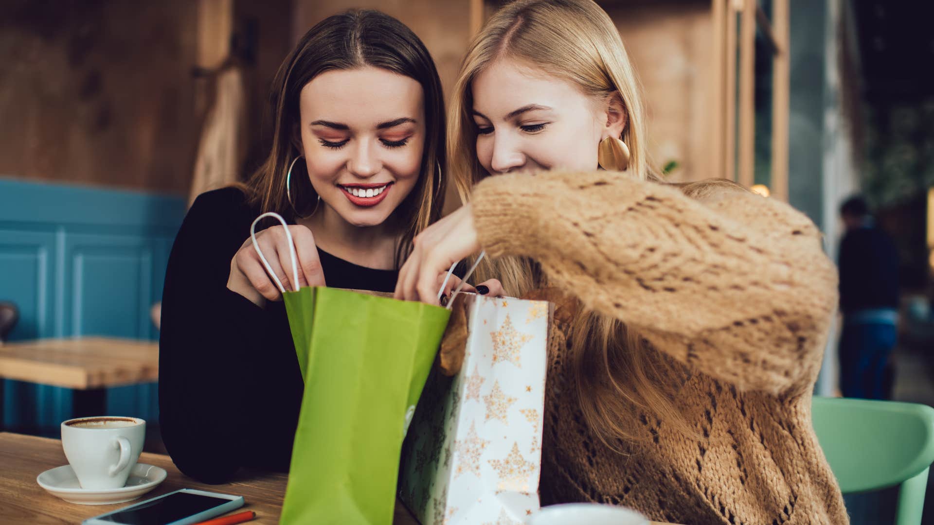 woman who asks for practical gifts opening present with friend