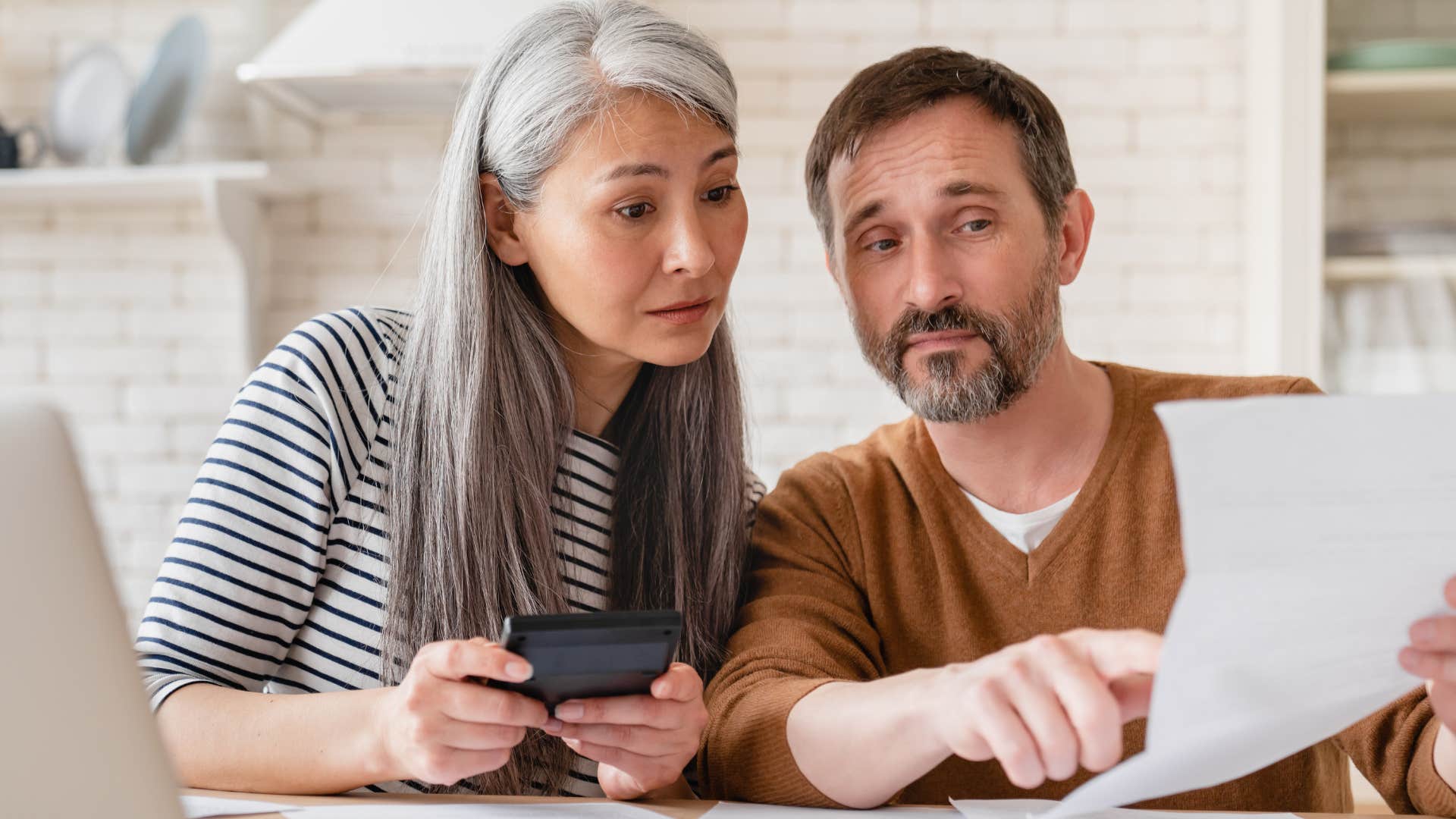 frugal couple tracking everything doing bills