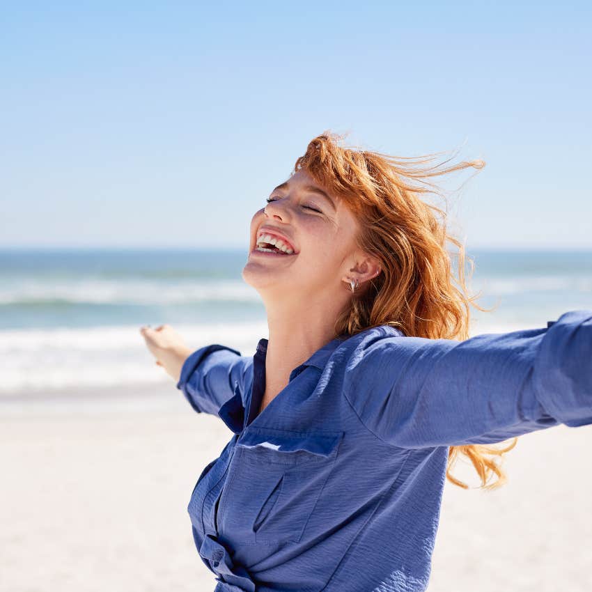 happy woman who lives by the principle to stop comparing herself