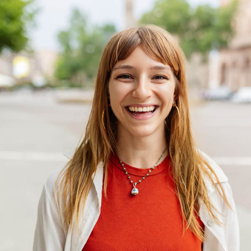 happy woman who lives by the principle to stop complaining